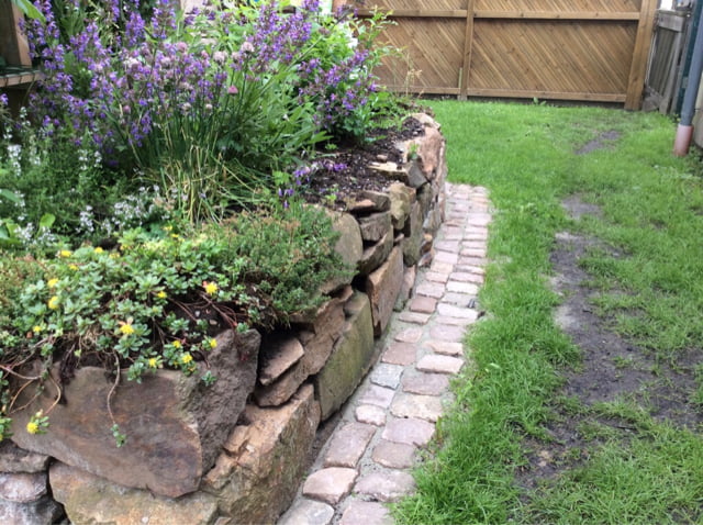 Robotic lawn mower lawn edging stones